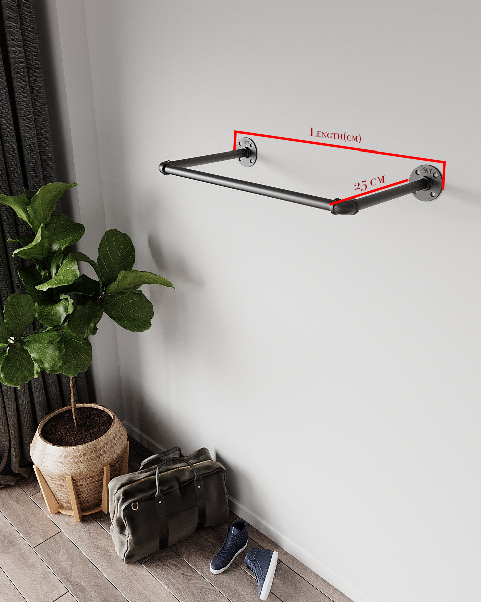 Atha Clothes Rail, a sturdy industrial pipe-based wall-mounted clothes rack, suitable for home or retail use.