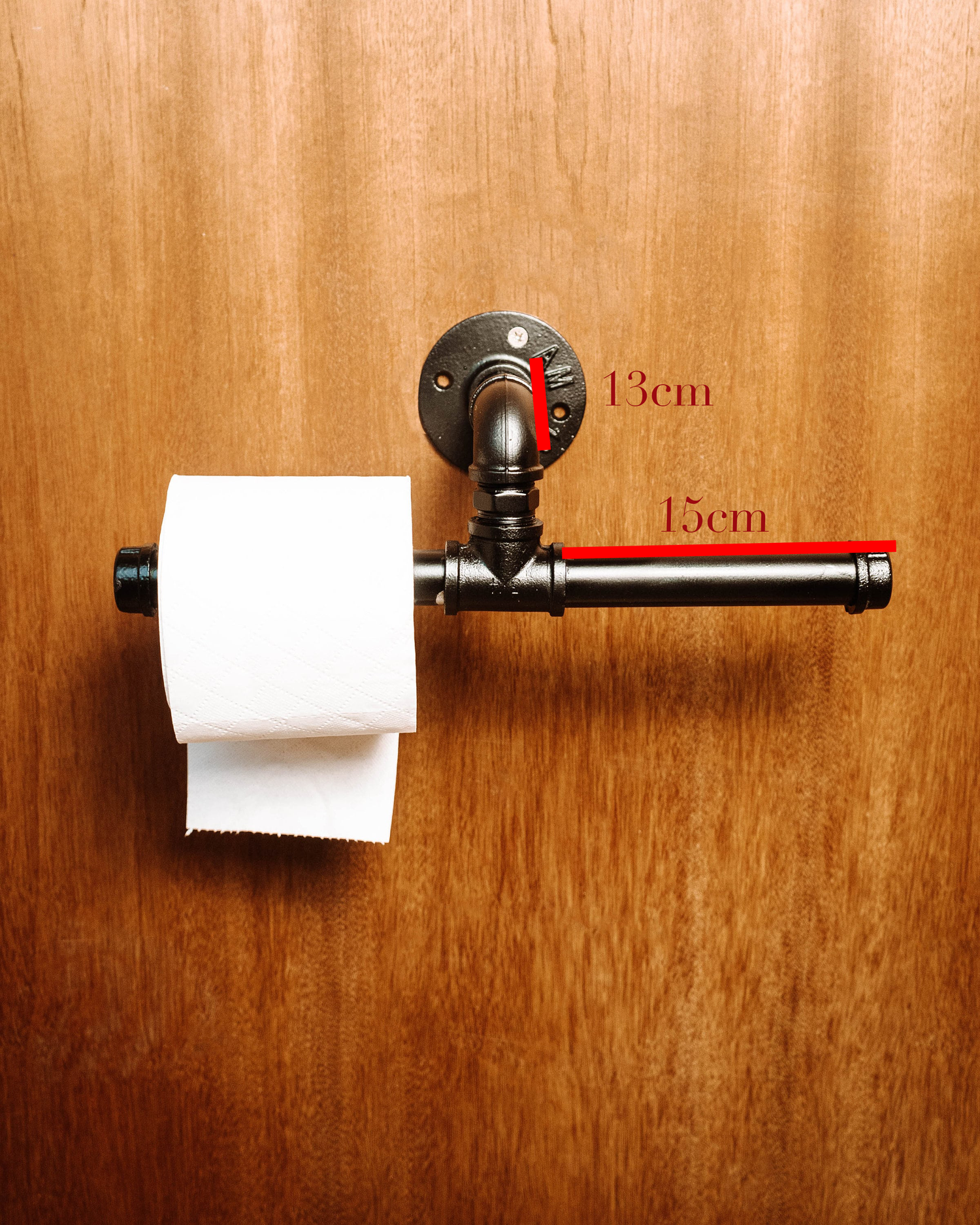 Toilet Roll Holder mounted on the wall, showcasing its sleek and practical design.