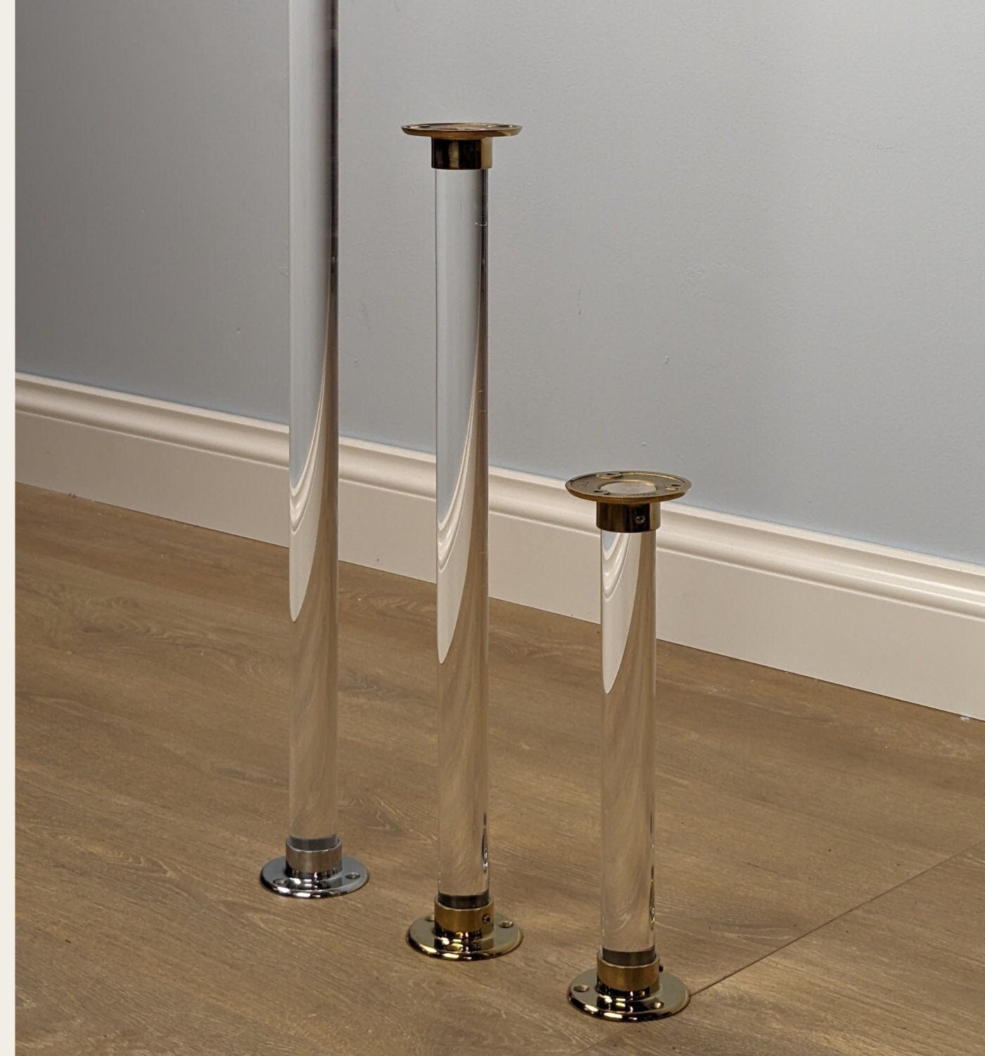 Single tapered clear glass furniture leg, ideal for replacing sofa legs or DIY projects. Made from heavy-duty acrylic for durability and modern elegance. Perfect for enhancing the look and functionality of furniture.