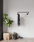 Atha Clothes Rail, a sturdy industrial pipe-based wall-mounted clothes rack, suitable for home or retail use.