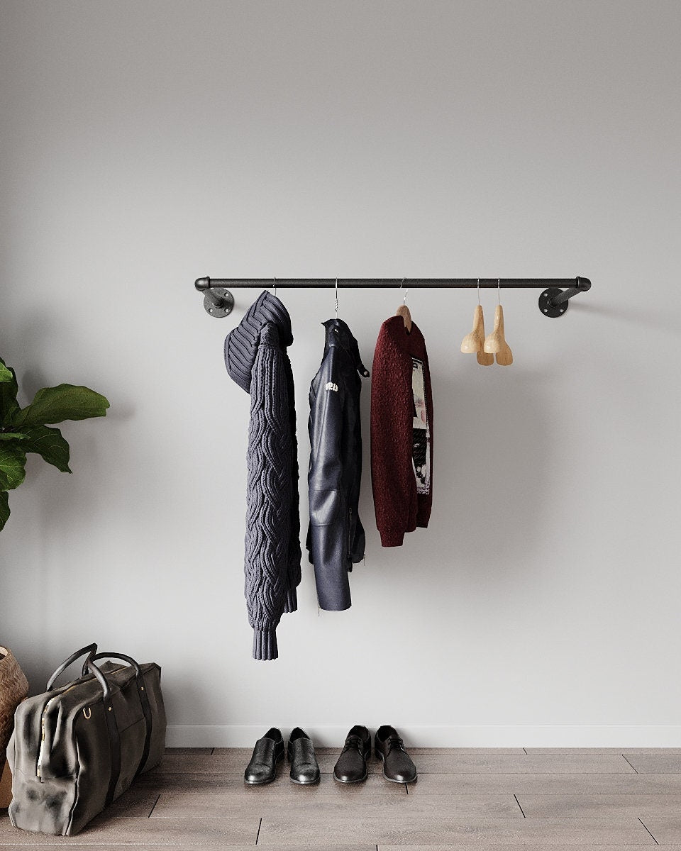Industrial Pipe Wall Mounted Clothing Rack, a sleek and durable clothes rail and open wardrobe solution, suitable for various aesthetic settings.