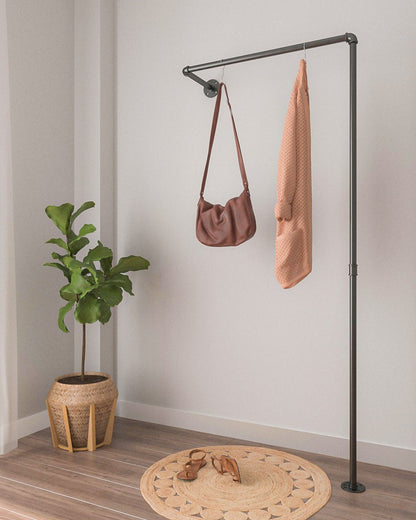 Clothes Rail, a wall-mounted and floor support rack, showcasing its modern pipe design